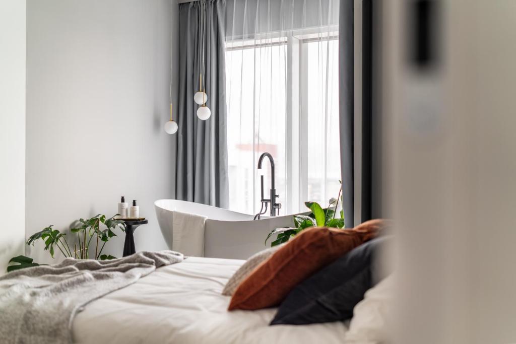 Ένα ή περισσότερα κρεβάτια σε δωμάτιο στο Choya Apartments