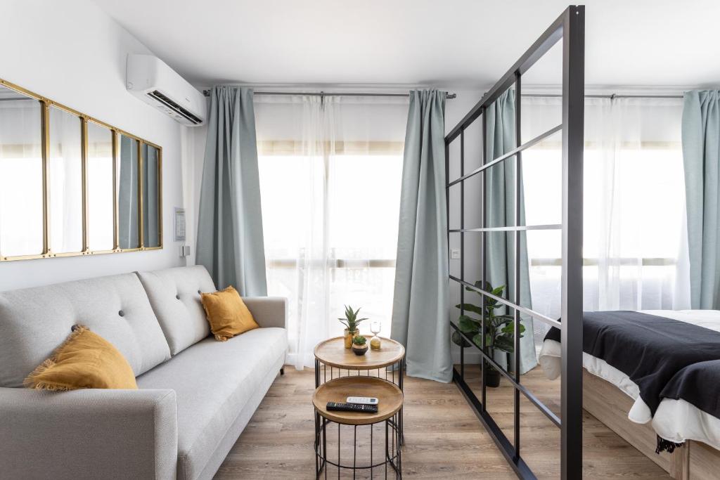 A bed or beds in a room at OleHolidays 644 Romana Playa Vista Panorámica Mar