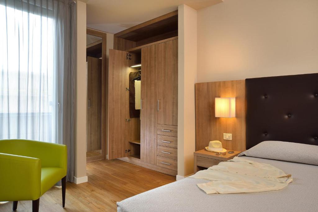 Posteľ alebo postele v izbe v ubytovaní Hotel Rossini
