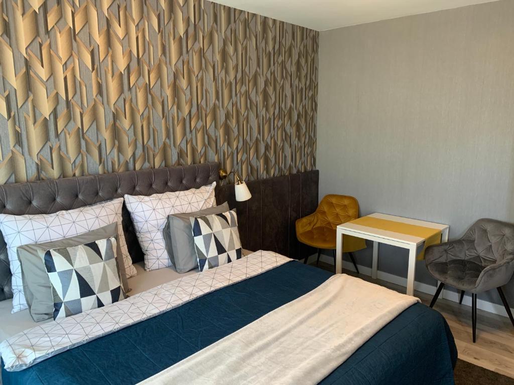 Voodi või voodid majutusasutuse Hollik Apartmanház toas