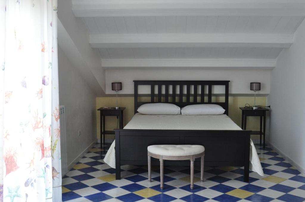A bed or beds in a room at CASSIODORO SUITE B&B