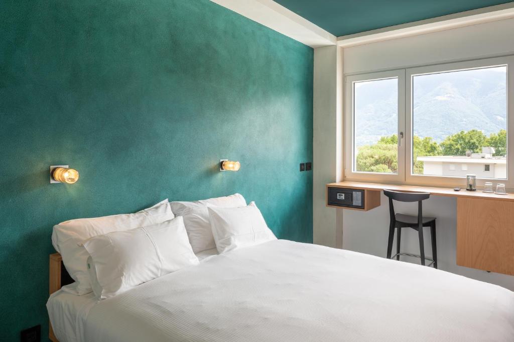 Postel nebo postele na pokoji v ubytování Riva Rooms & Studios - Check-In 24hr