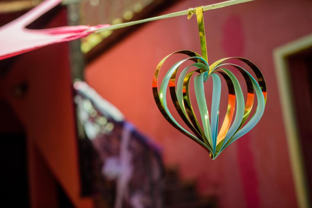 a heart hanging on a clothes line at BRUNETTE BEAUTIES Guesthouse & Studio Sinemorets in Sinemorets