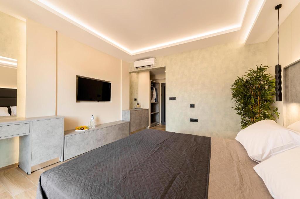Televízia a/alebo spoločenská miestnosť v ubytovaní Megusta Suites