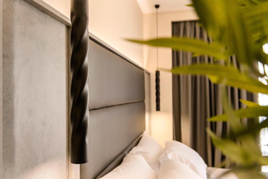Posteľ alebo postele v izbe v ubytovaní Megusta Suites
