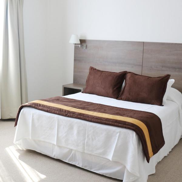 Postel nebo postele na pokoji v ubytování Conrado Hotel Osorno
