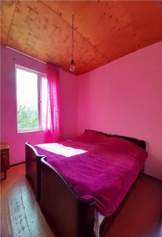 Postel nebo postele na pokoji v ubytování Guest House Malkhaz Niguriani
