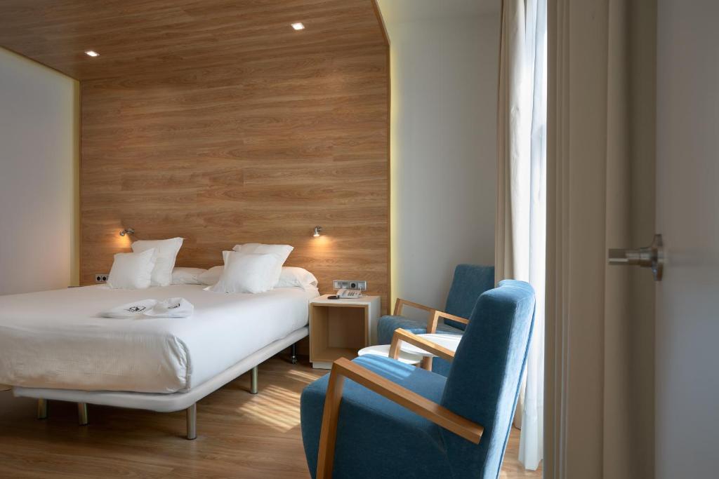 Postel nebo postele na pokoji v ubytování Hotel Monte Puertatierra