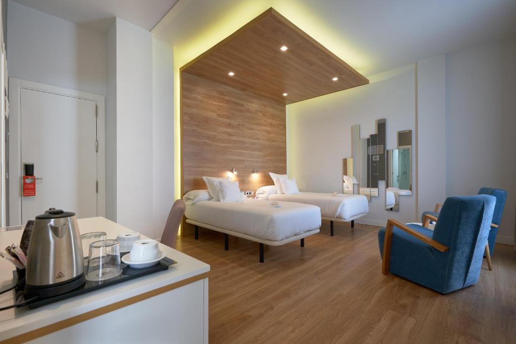 Postel nebo postele na pokoji v ubytování Hotel Monte Puertatierra