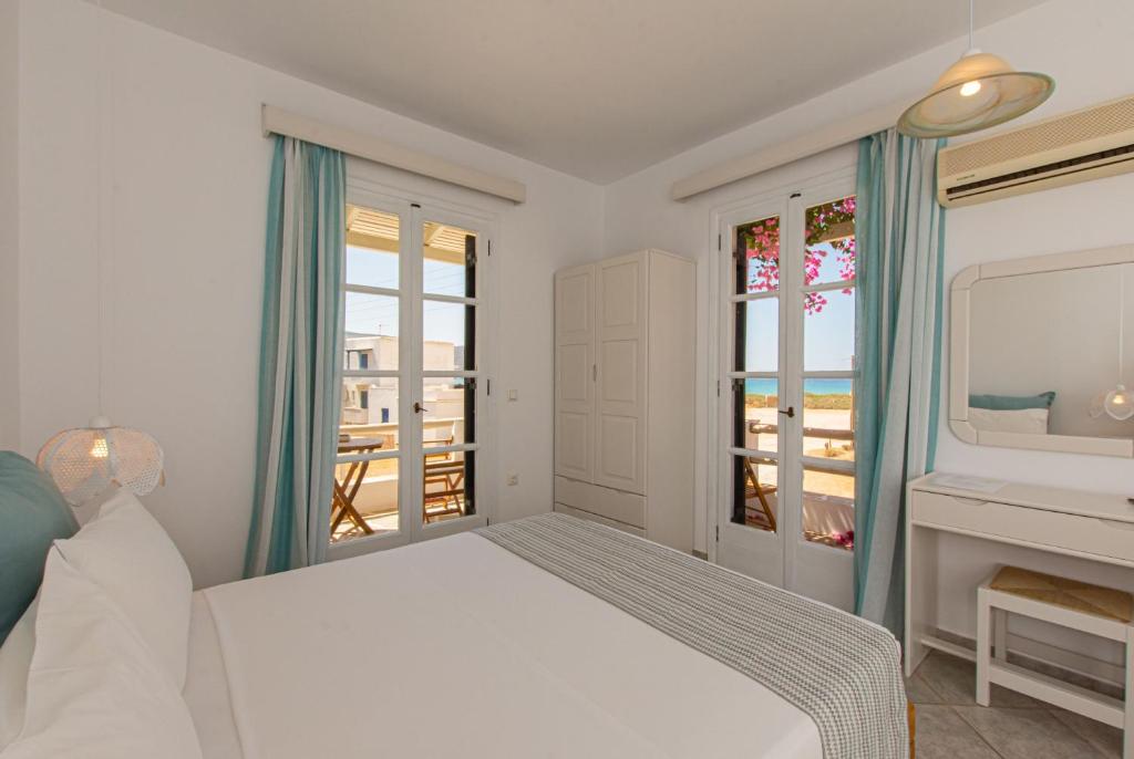 A bed or beds in a room at Studios Strouvalis
