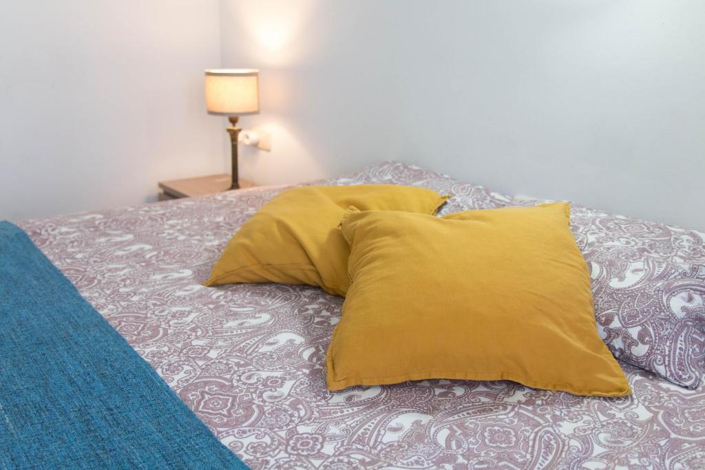 Posteľ alebo postele v izbe v ubytovaní La plaza apartment
