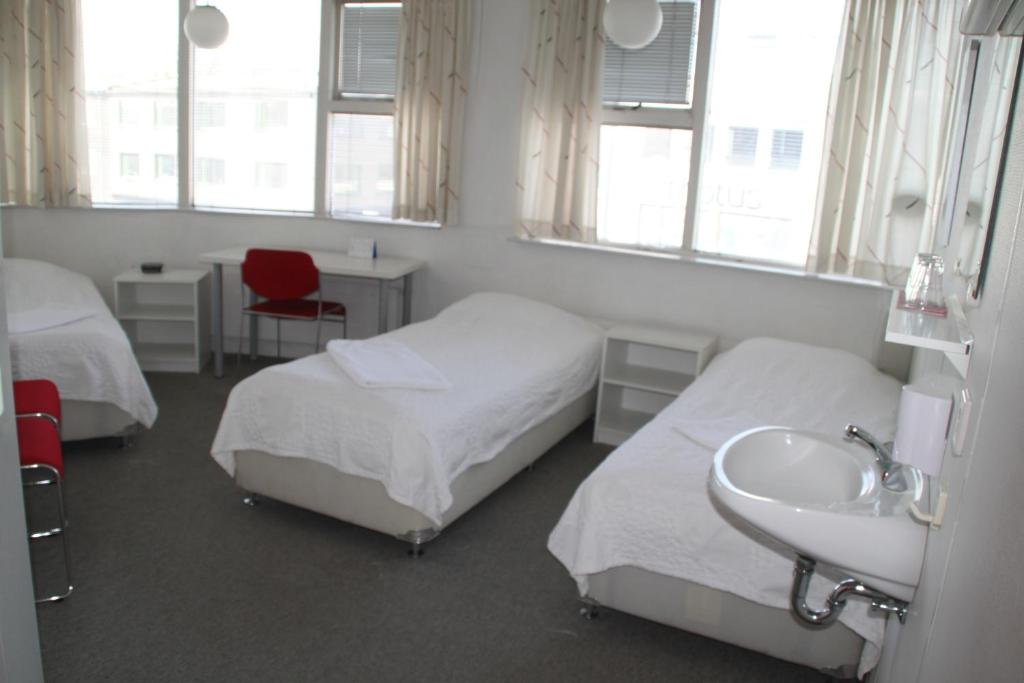 Letto o letti in una camera di 101 Guesthouse Hotel