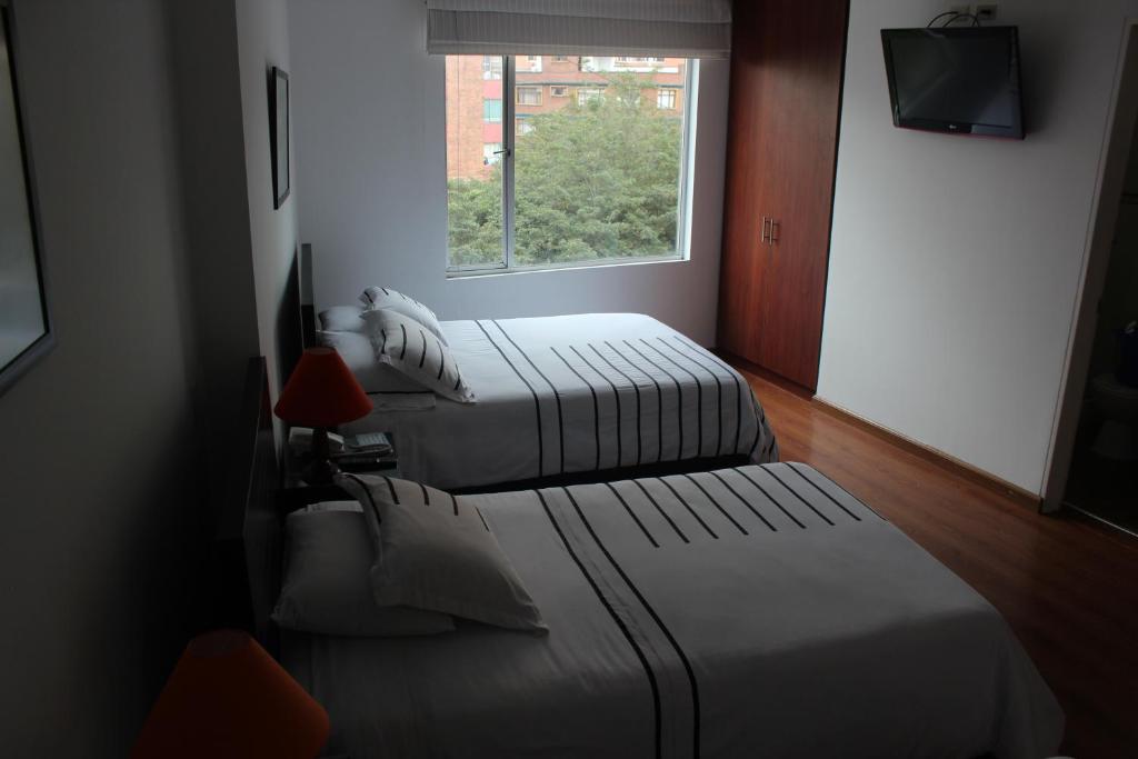 Postel nebo postele na pokoji v ubytování Hotel Real Estación