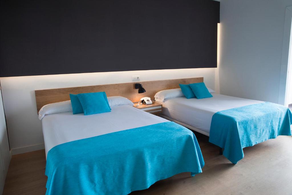 Hotel Brisamar Suitesにあるベッド