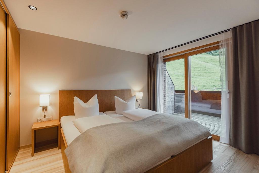 Postel nebo postele na pokoji v ubytování Hotel Gasthof Adler