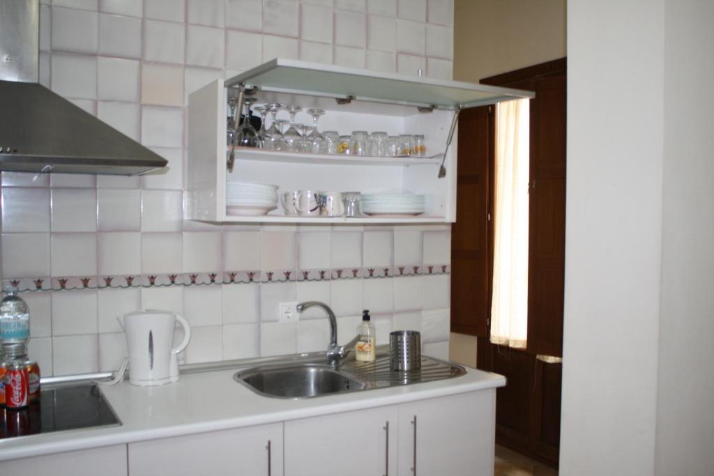 Kuchyň nebo kuchyňský kout v ubytování Abadia Suites