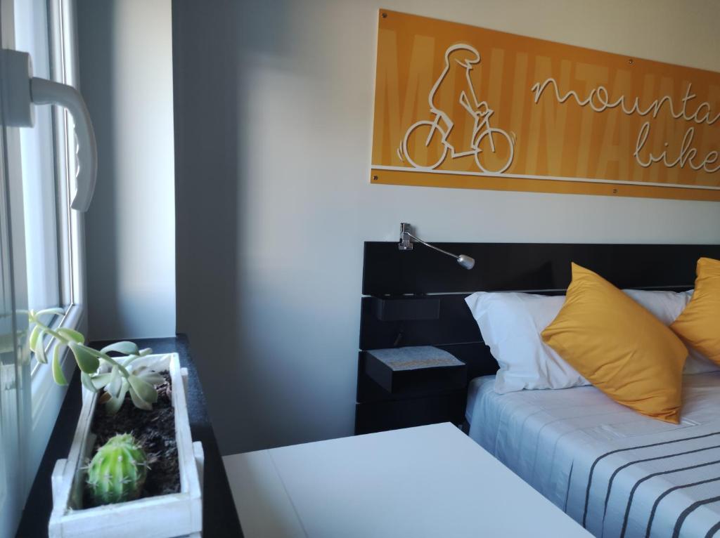 Łóżko lub łóżka w pokoju w obiekcie b&b La Bicicletta