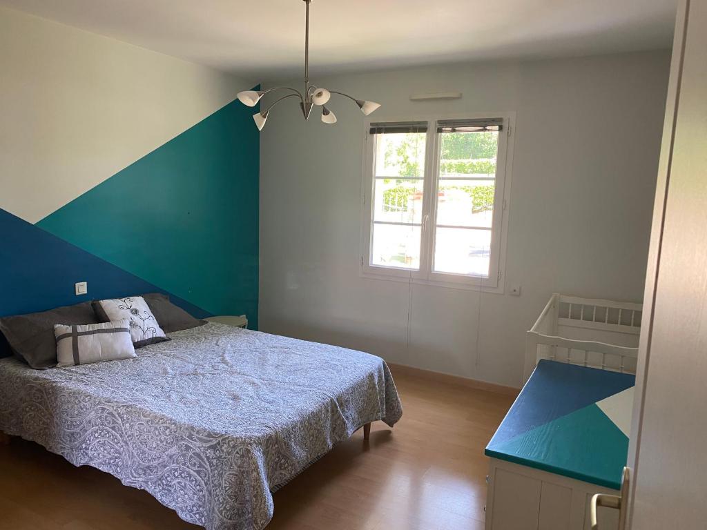 Säng eller sängar i ett rum på Vendée - Maison de Vacances