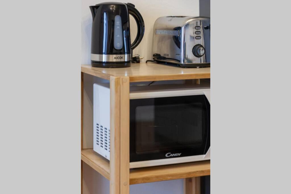 Kuchyňa alebo kuchynka v ubytovaní Lazzi - A.C. - Wi-Fi - Flexyrent Apartment