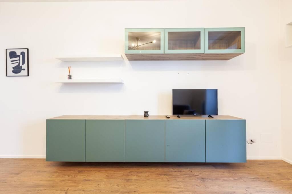 Televízia a/alebo spoločenská miestnosť v ubytovaní Lazzi - A.C. - Wi-Fi - Flexyrent Apartment