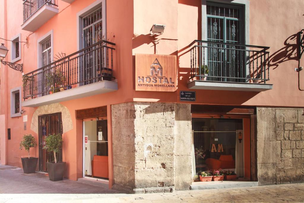 a building with a museum sign on the side of it at Hostal Antigua Morellana in Valencia