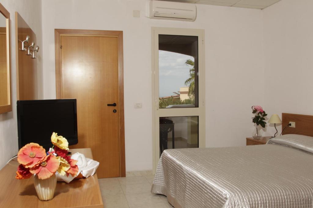 Posteľ alebo postele v izbe v ubytovaní Hotel Club Bellavista