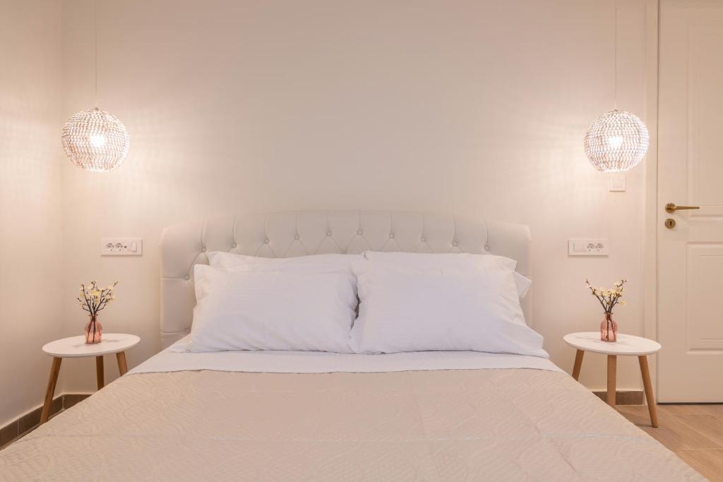 Postel nebo postele na pokoji v ubytování Blush & Crema Apartments