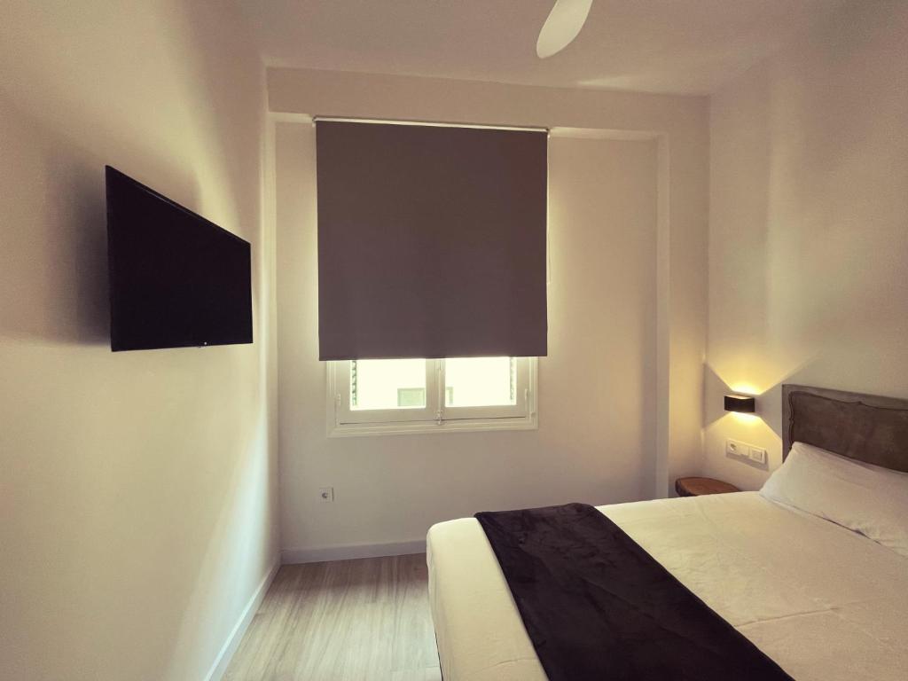 Postel nebo postele na pokoji v ubytování Town Hall Suite