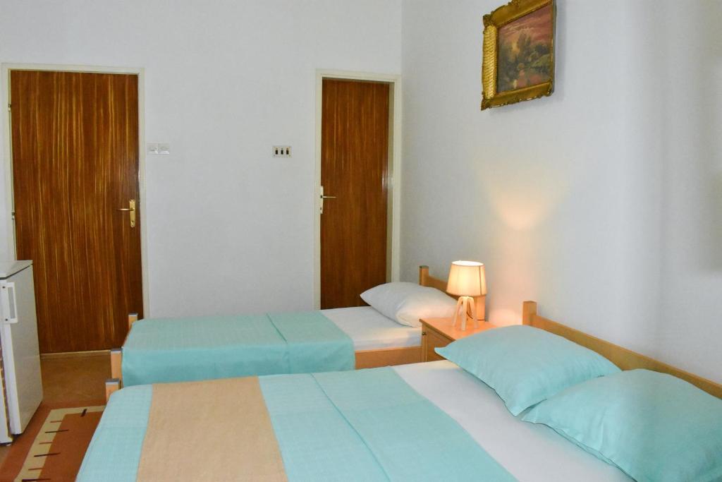 Postel nebo postele na pokoji v ubytování Guesthouse Elsa