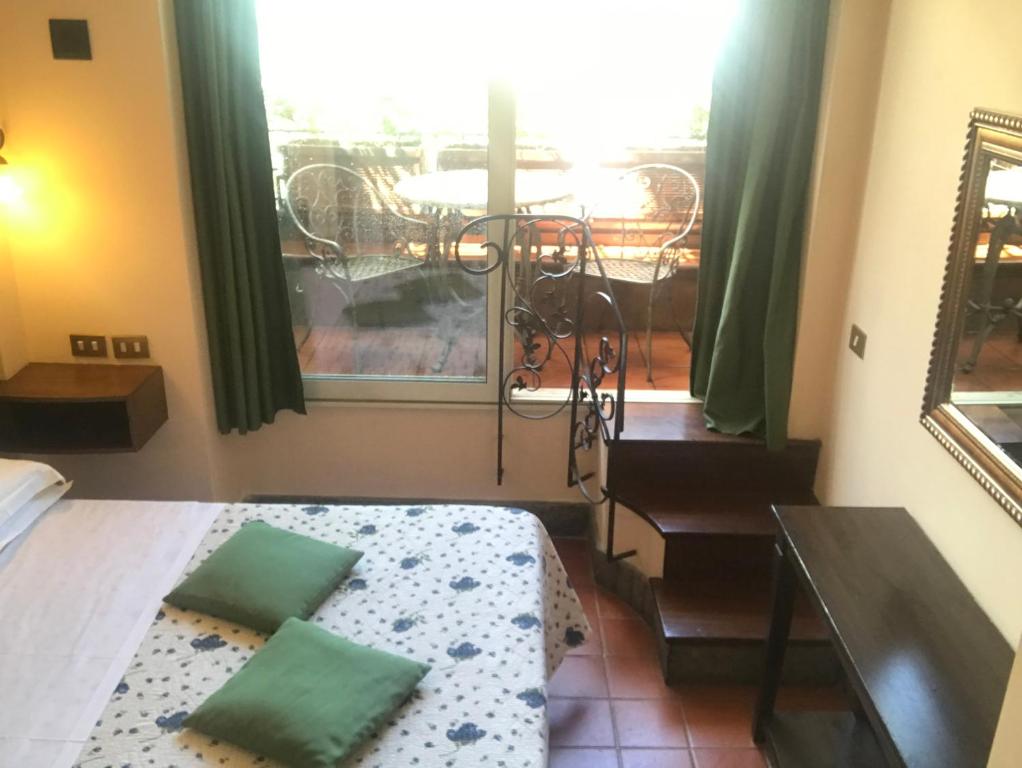 Postel nebo postele na pokoji v ubytování Hotel OKAPI