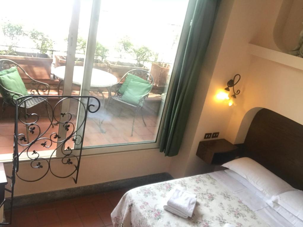 Postel nebo postele na pokoji v ubytování Hotel OKAPI