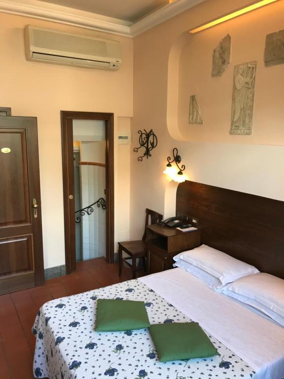 Postel nebo postele na pokoji v ubytování Hotel OKAPI
