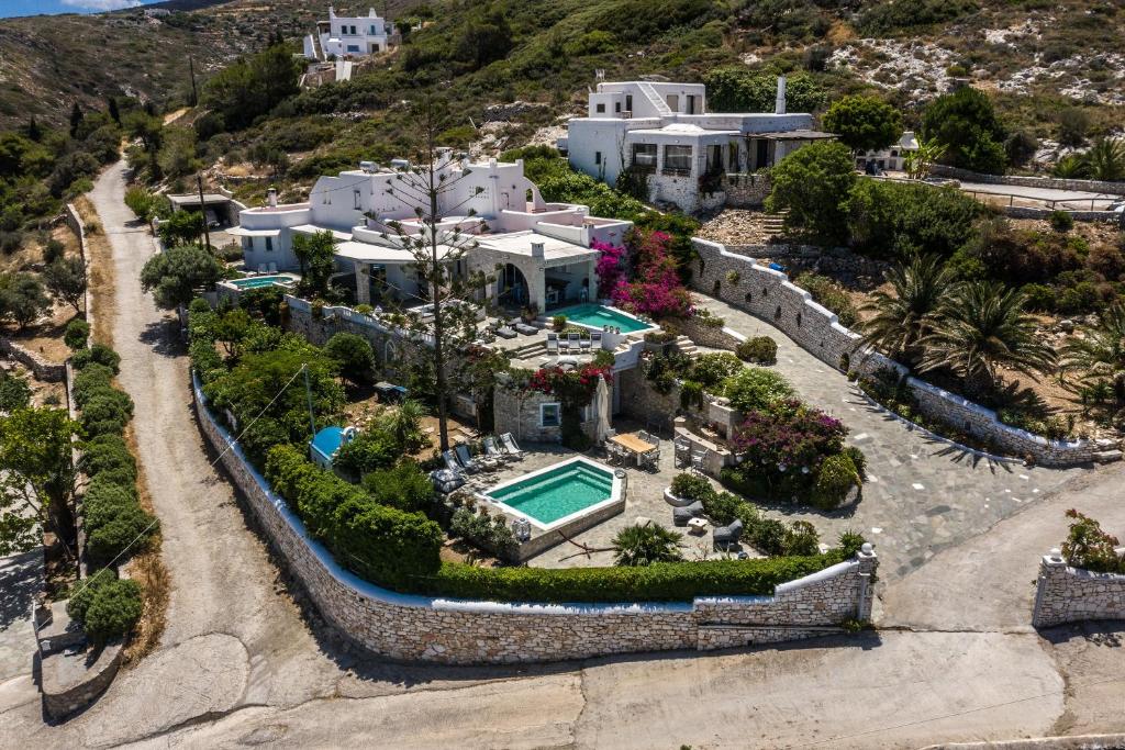 an aerial view of a house with a swimming pool at Villa Haritomeni in Parikia