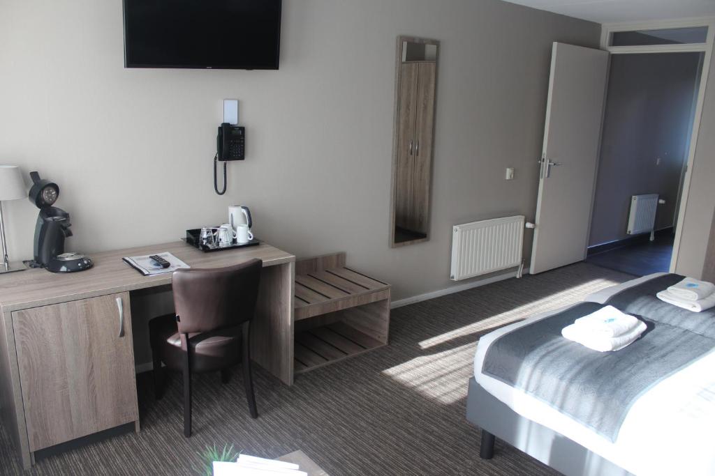 Postel nebo postele na pokoji v ubytování Hotel Restaurant 't Klokje