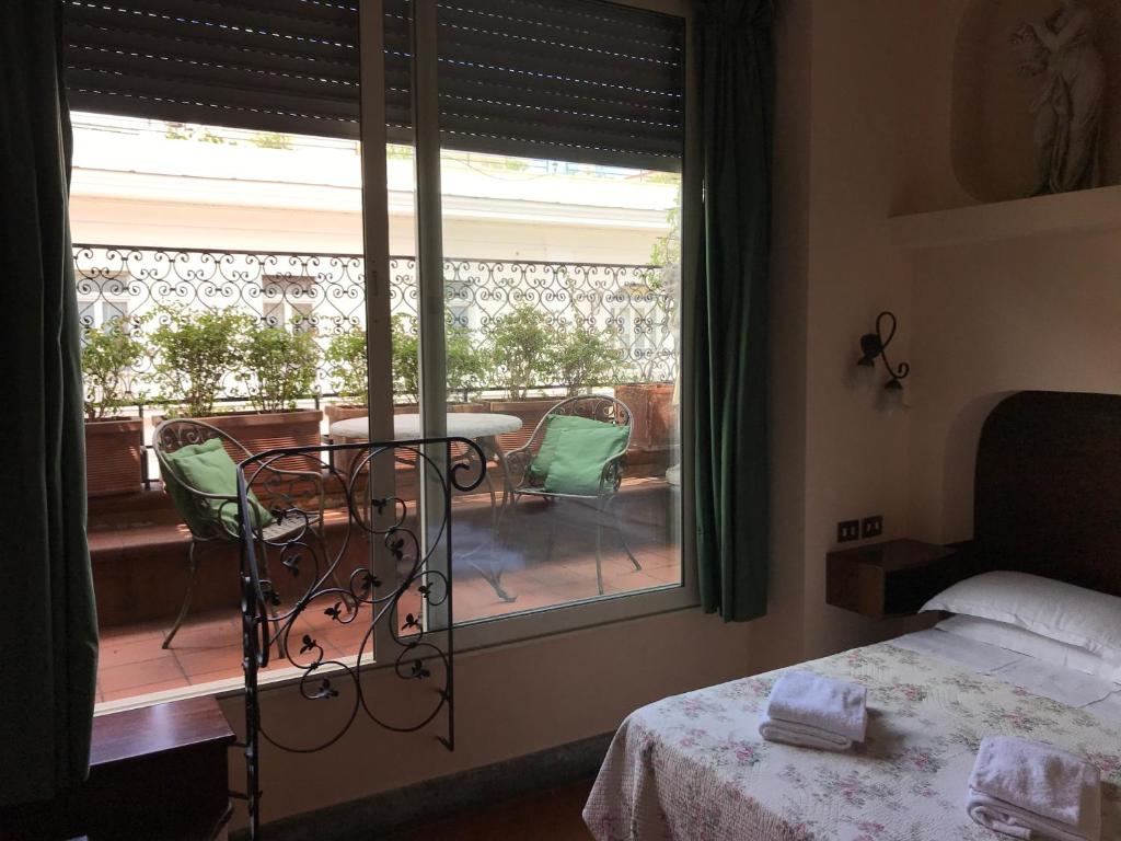 Postel nebo postele na pokoji v ubytování Hotel OKAPI