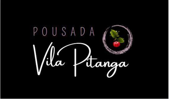 a sign that reads pucaleza wa puciana with a red tomato at Pousada Vila Pitanga in Santos