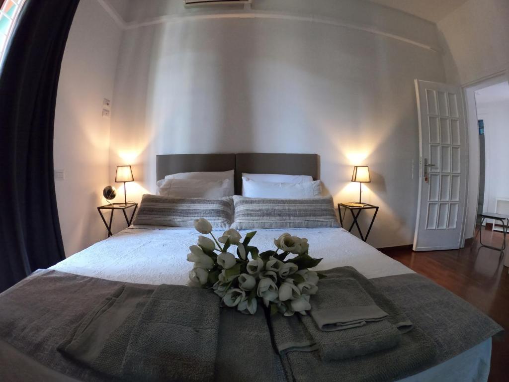 A bed or beds in a room at EMI's Guest House