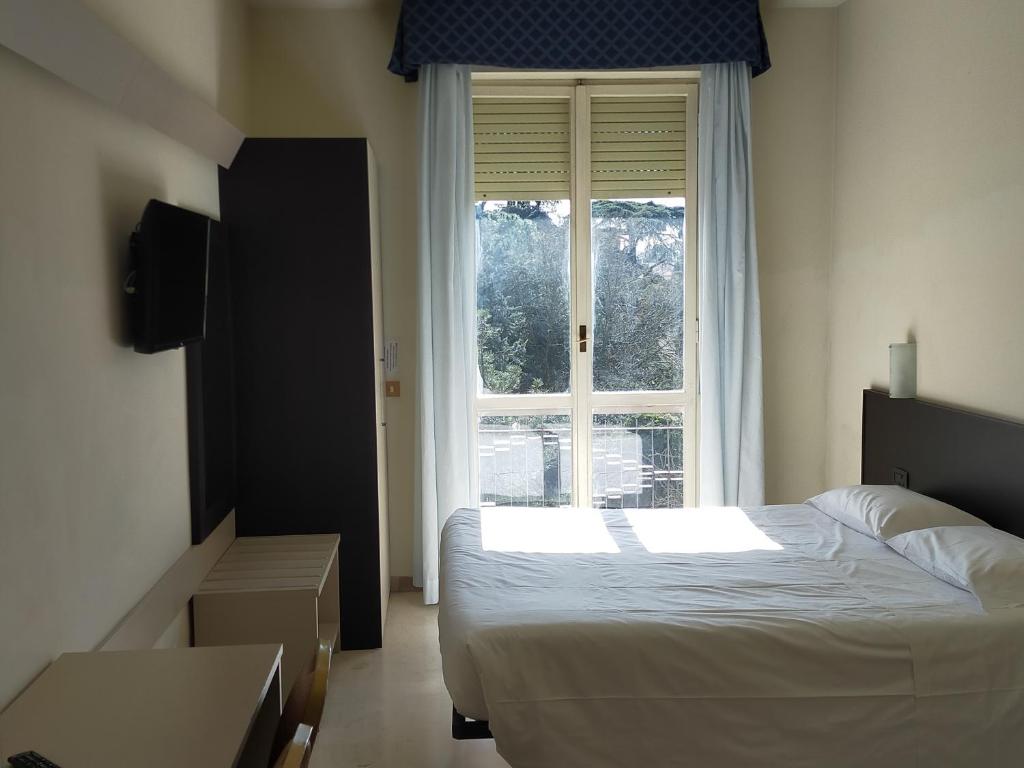 Posteľ alebo postele v izbe v ubytovaní AUTO PARK Hotel