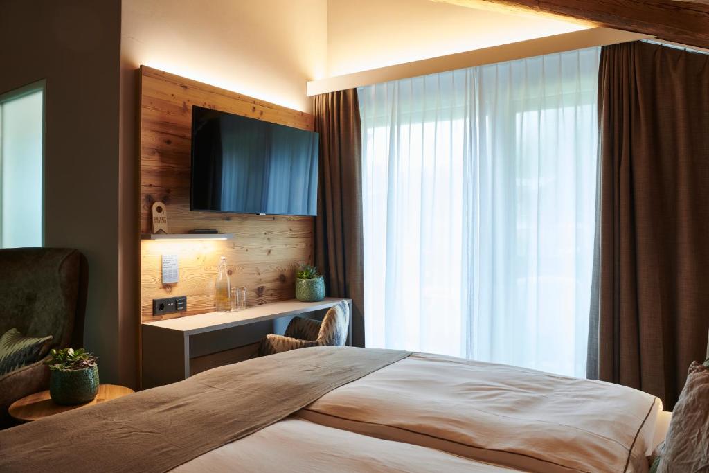 Postel nebo postele na pokoji v ubytování Matthiol Boutique Hotel