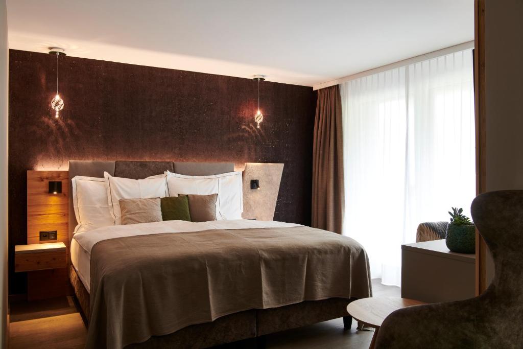 Postel nebo postele na pokoji v ubytování Matthiol Boutique Hotel