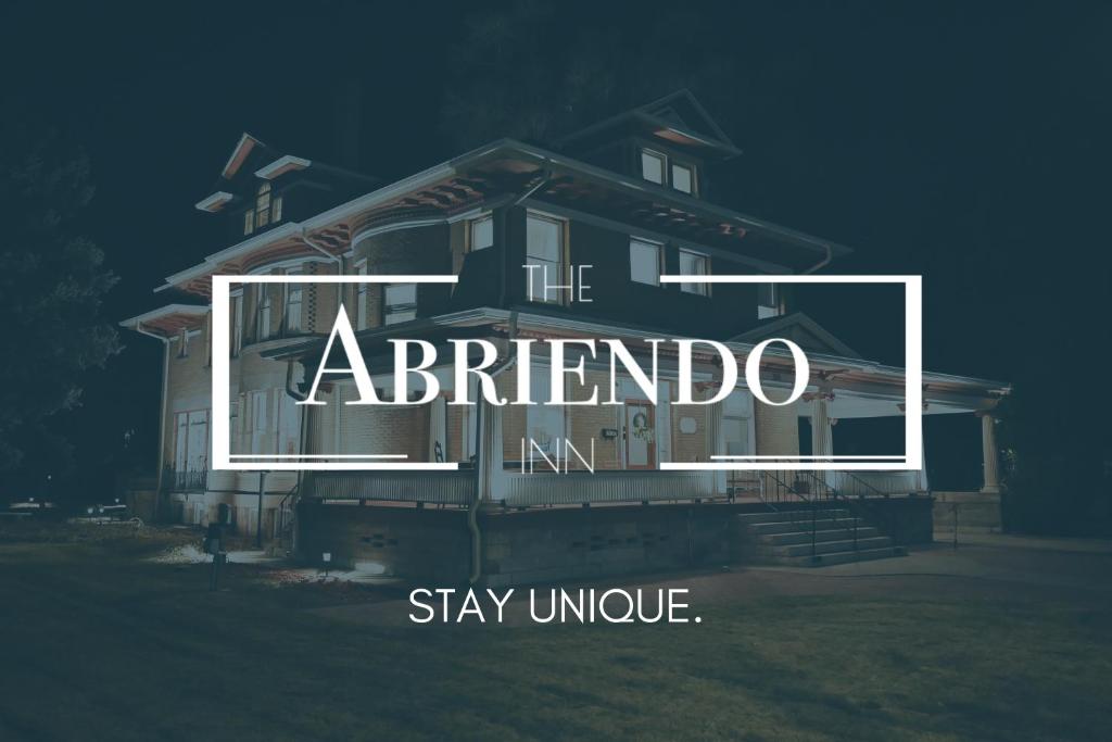 a house with a sign that reads the abfriendo stay unique at The Abriendo Inn in Pueblo