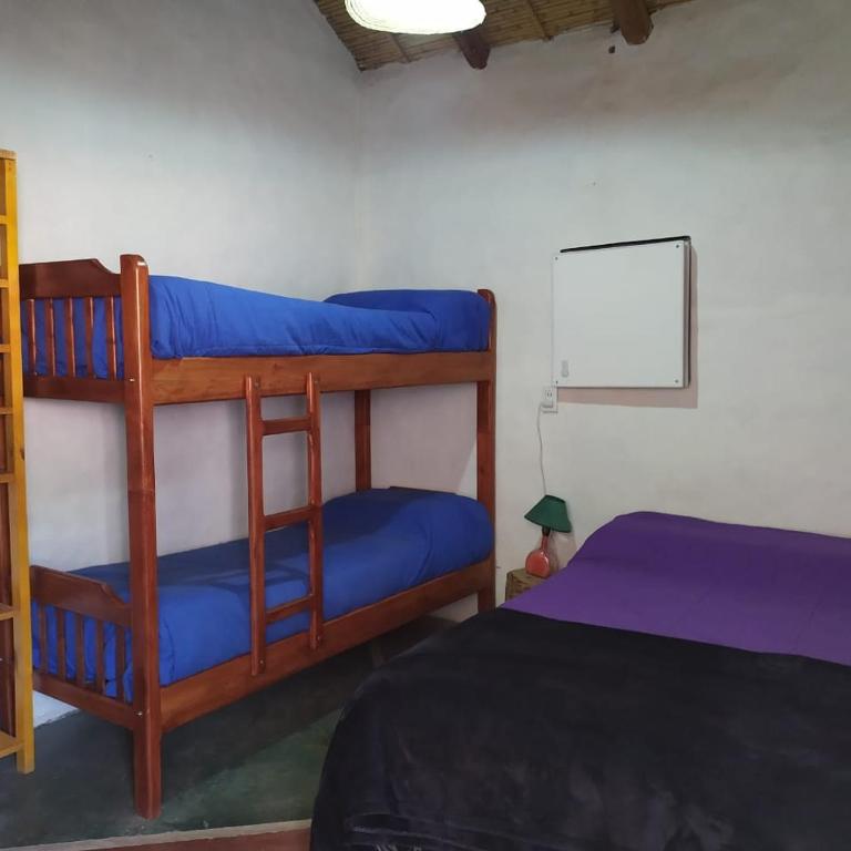 Postel nebo postele na pokoji v ubytování Cabañitas EL REPOSO HUMAHUACA