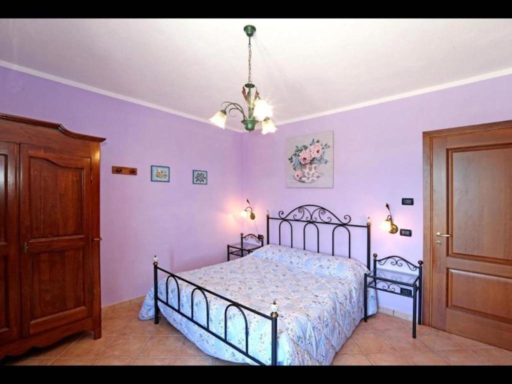 Łóżko lub łóżka w pokoju w obiekcie Agriturismo Al Brich Quadriple room with breakfast