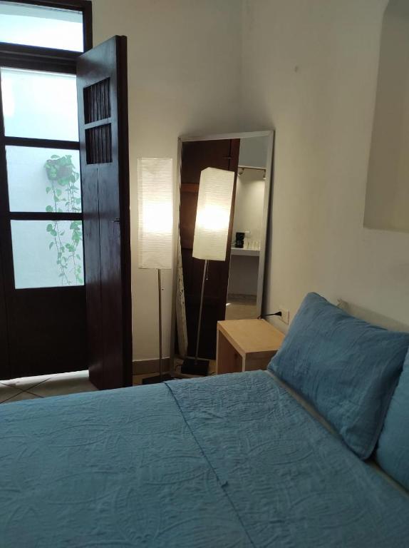 Postel nebo postele na pokoji v ubytování Carlota Guest House