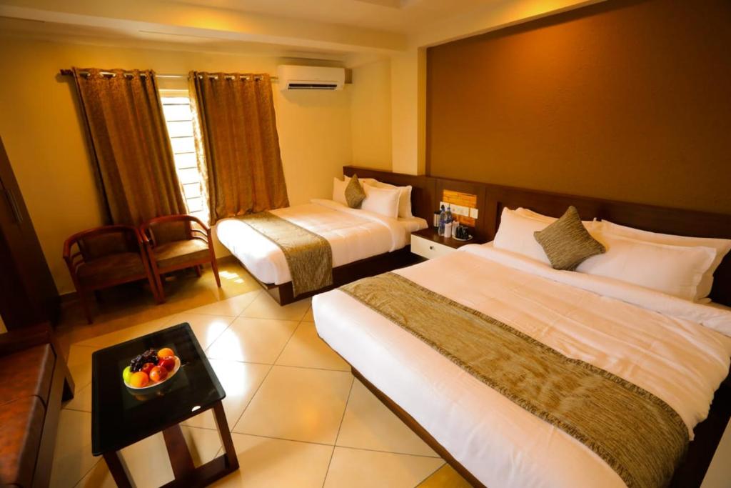 Postel nebo postele na pokoji v ubytování Zubis Inn Hotel