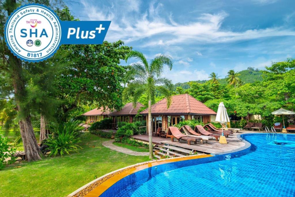 a villa with a swimming pool in a resort at Thiwson Beach Resort - SHA Extra Plus in Ko Yao Yai