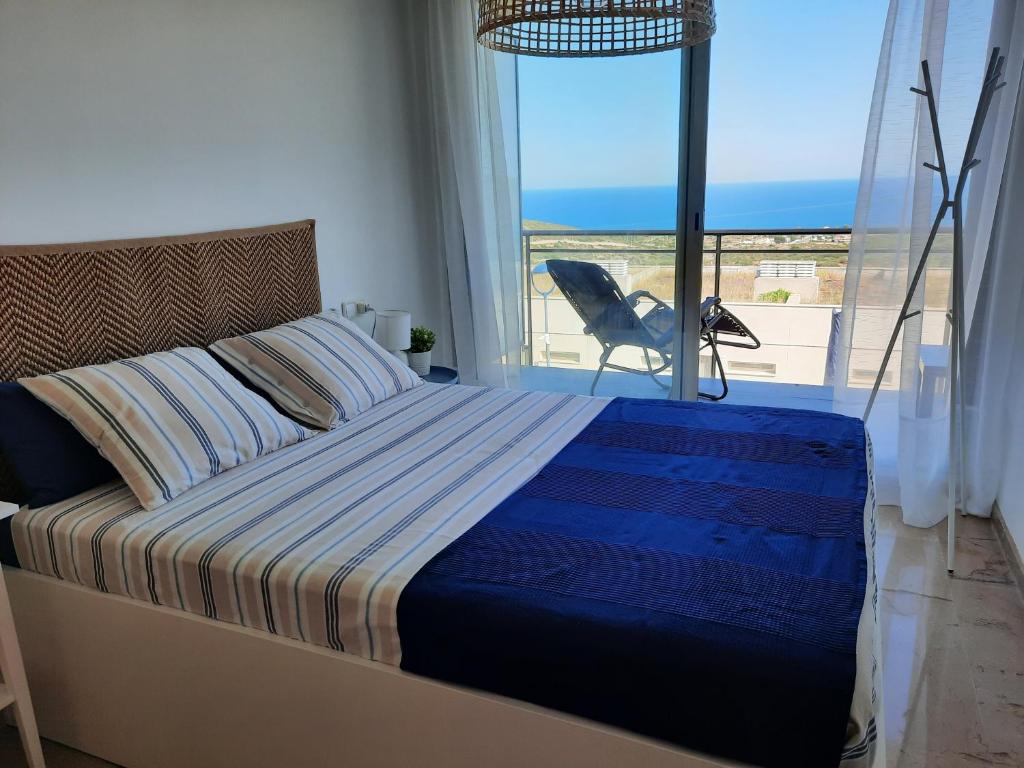 Ένα ή περισσότερα κρεβάτια σε δωμάτιο στο Casa Sierra y Playa 7 pers, Mascotas, Wifi, Parking gratis