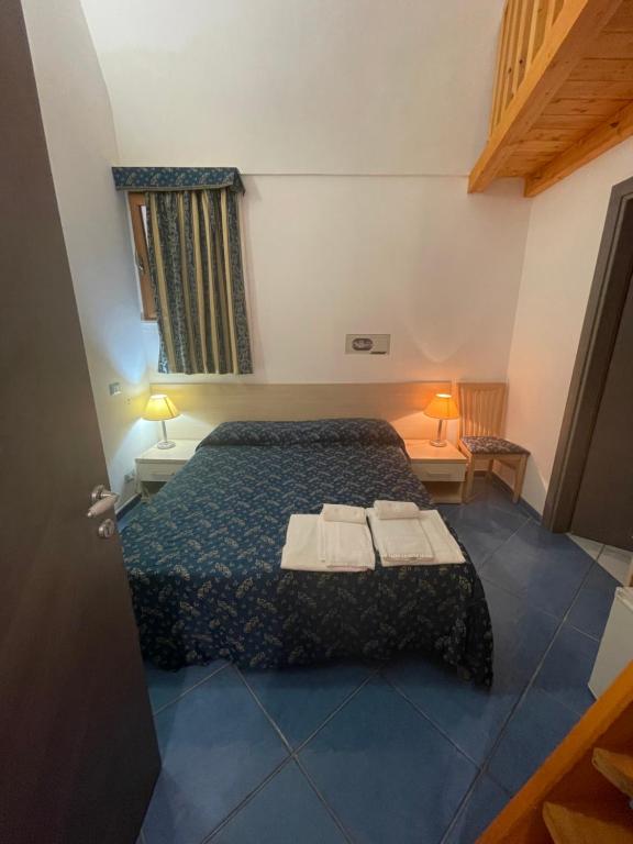 Postel nebo postele na pokoji v ubytování B&B La Terrazza Sul Porto