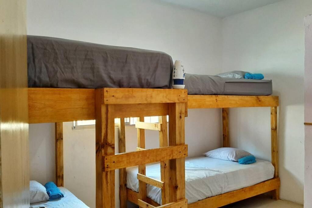 Postel nebo postele na pokoji v ubytování El Costeñito Hostal