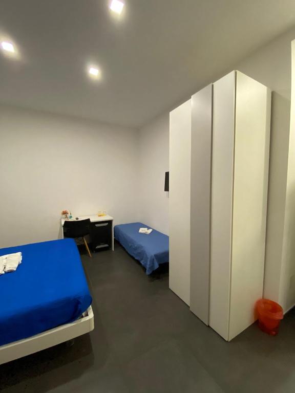 Postel nebo postele na pokoji v ubytování Amuri Room&Suite